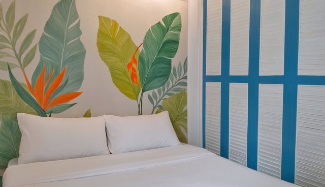 Two separate studio units on the same floor of a midrise condominium building.
