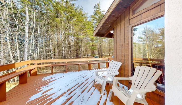 Two-story home with a fireplace & deck - across the street from lake access