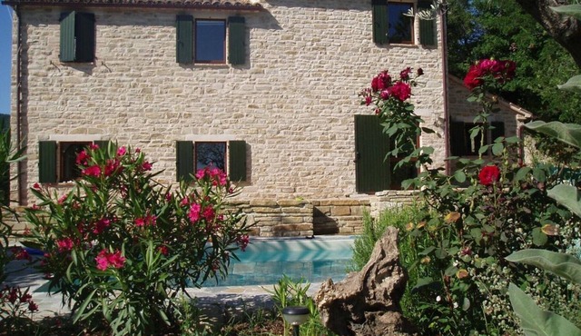 Typical Italian stone house with pool in a quiet hillside location with 2 apartments