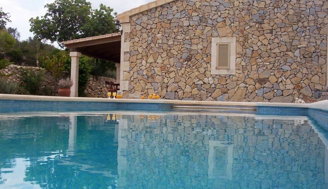 Typical Majorcan house with terrace and pool with beautiful sunset.