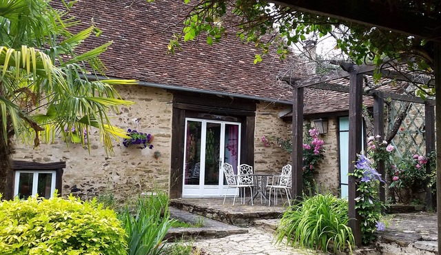 Typical stone house with swimming pool surrounded by nature