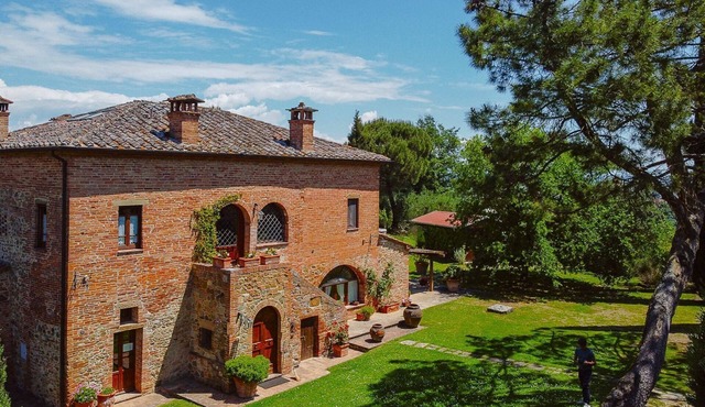 Typical villa with private swimming pool with panoramic view over the village of Torrita di Siena. S