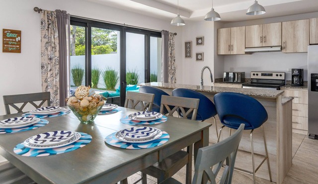 Ultramodern Townhome with an Inviting Coastal Design and Lush Outdoor Oasis with a Private Pool