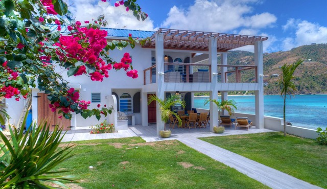 Unique beach front property steps away from the beautiful waters of brewers bay.