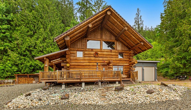 Unique mountain view log home with a wood stove, balcony, patio, & board games