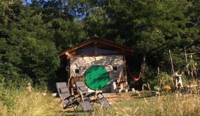 Unique offgrid forest cabin, hand built using recycled materials.