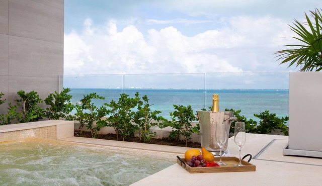 Unwrap Tropical Bliss: Experience Holiday Luxury in 3-Bedroom Ocean Front Oasis!