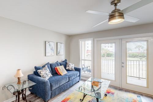Updated condo with balcony central AC pools hot tub grills & beach access