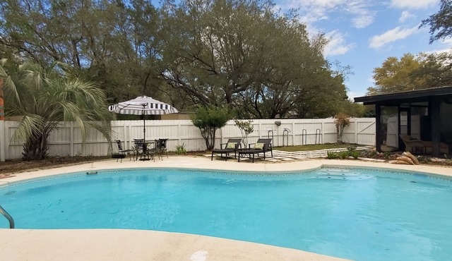 Updated dog-friendly home with private outdoor pool, patio, fireplace, W/D, AC