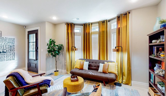 Updated townhome with ensuite bedrooms, workstation, & aquatic center pass