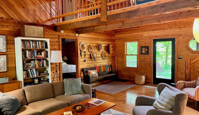Upscale 4-bedroom, 3 full bathroom lakeside log cabin in West Olive, Michigan.
