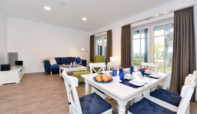 Vacation apartment with modern furnishings, terrace and sea view in Ralswiek