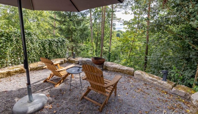 Vacation home Schrat with fireplace in an idyllic location on the edge of the forest below a wellness hotel.
