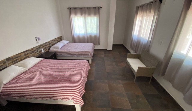 Very comfortable suite with 2 dbl beds, terrace and AC. Only 2 blocks from beach