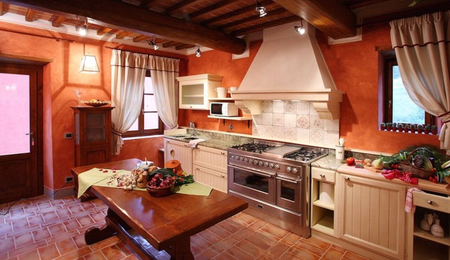 Villa Rossa rustic warmth typical of Tuscan country villas. 16 people.