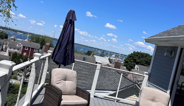 Walk to town! Spacious family home w/large deck boasting ocean view and sunsets!