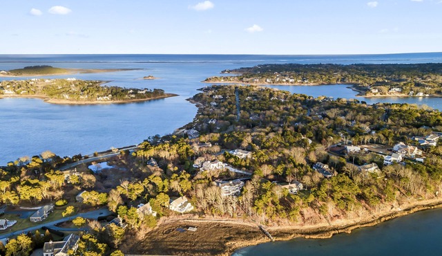 Water views, private beach and spectacular sunsets from highest point in town.