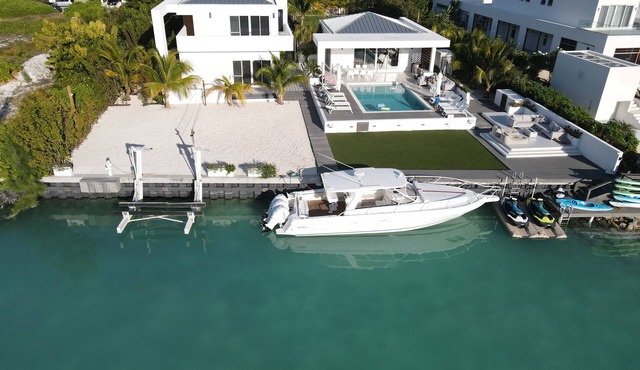 Waterfront Luxury Villa with Optional Boat and Beach Access Just Steps Away