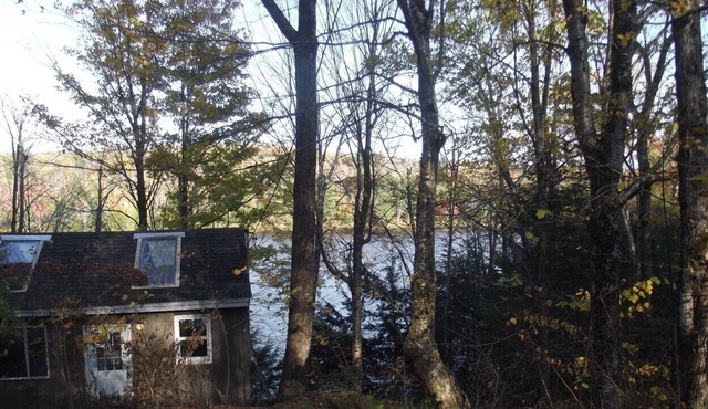 Waterfront Camp looking down on water from deck.