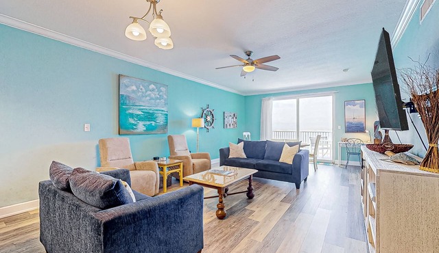 Waterfront condo with beach access, pools, balcony, central AC, & W/D
