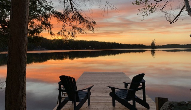 Waterfront Cottage w/Sunset Views, Dock, & Family Fun | Kayaks, Firepit, Fishing