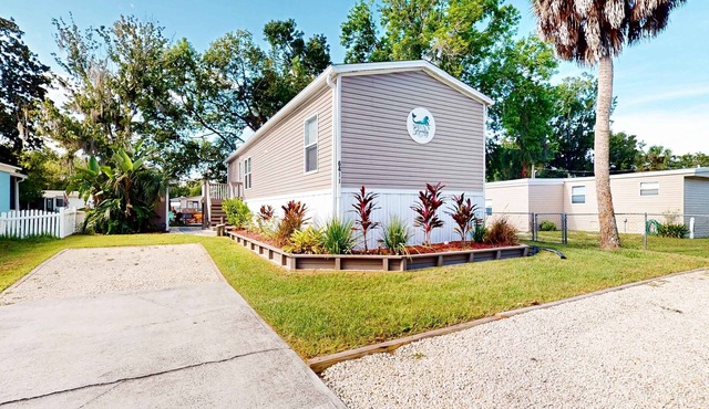 Waterfront home with amazing yard firepit grill putting green AC and WD