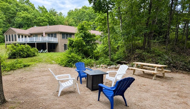 Waterfront home with a fireplace, grill, deck, washer/dryer, & AC - dog-friendly
