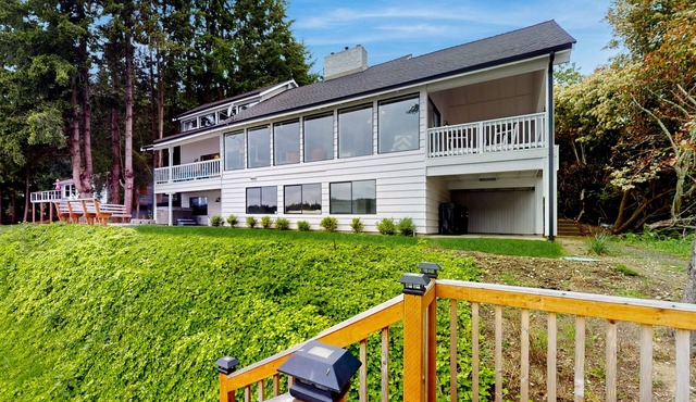 Waterfront home with hot tub, deck pool table and firepit
