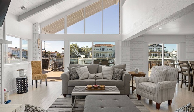 Waterfront home with kayaks, grill, Pac-Man, AC, balconies, & smart TVs