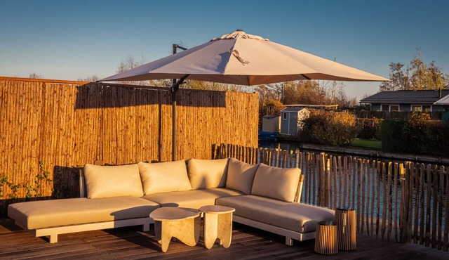 Waterfront luxury tiny home near Amsterdam with spacious private garden