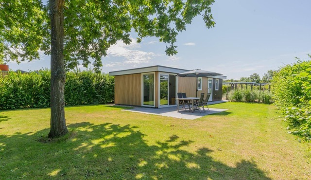 What immediately catches your eye upon entering is the garden-oriented living room with open kitchen