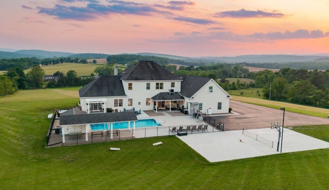 Willow Brook Mansion, an upscale retreat in the countryside with heated seasonal (May 1st - Oct. 1st) pool, hot tub and game room.