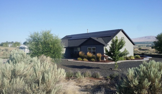 Wine tasting from this eco-friendly home with stunning views.