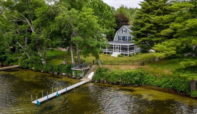 Winnipesaukee waterfront escape with private dock and guest cottage