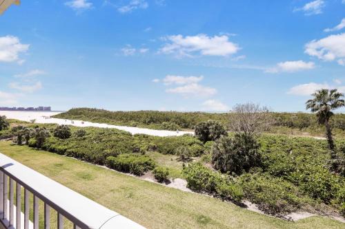 Beachfront condo with pool and wraparound balcony