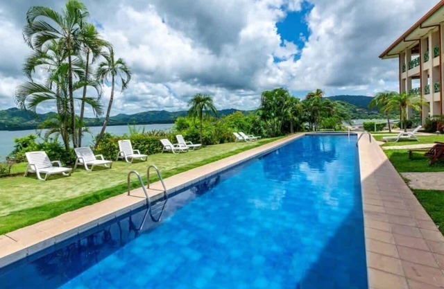Elegant Condo with Brand-New Fixtures, Shaded Tropical Terrace, and Secluded Beach Access