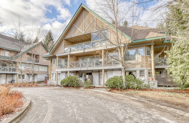 Ideal first-floor getaway with hot tub, fireplace, & balcony - walk to lifts