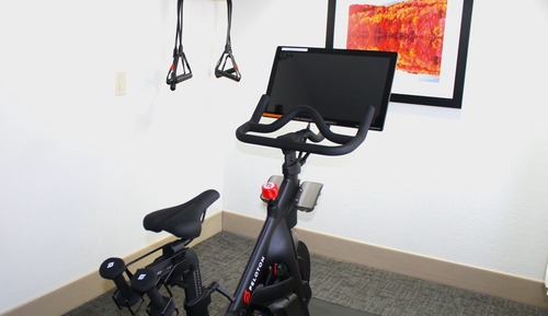 1 Queen Bed with Peloton Exercise Bicycle