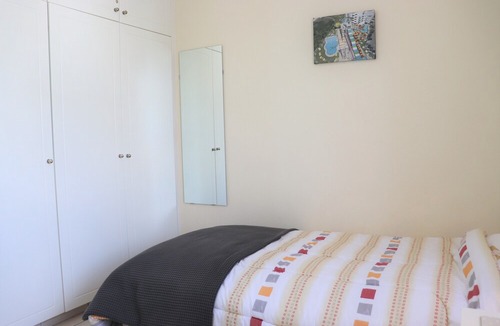 Peyia Town House | Direct access to the pool from the garden. A sandy beach is a few minutes away.